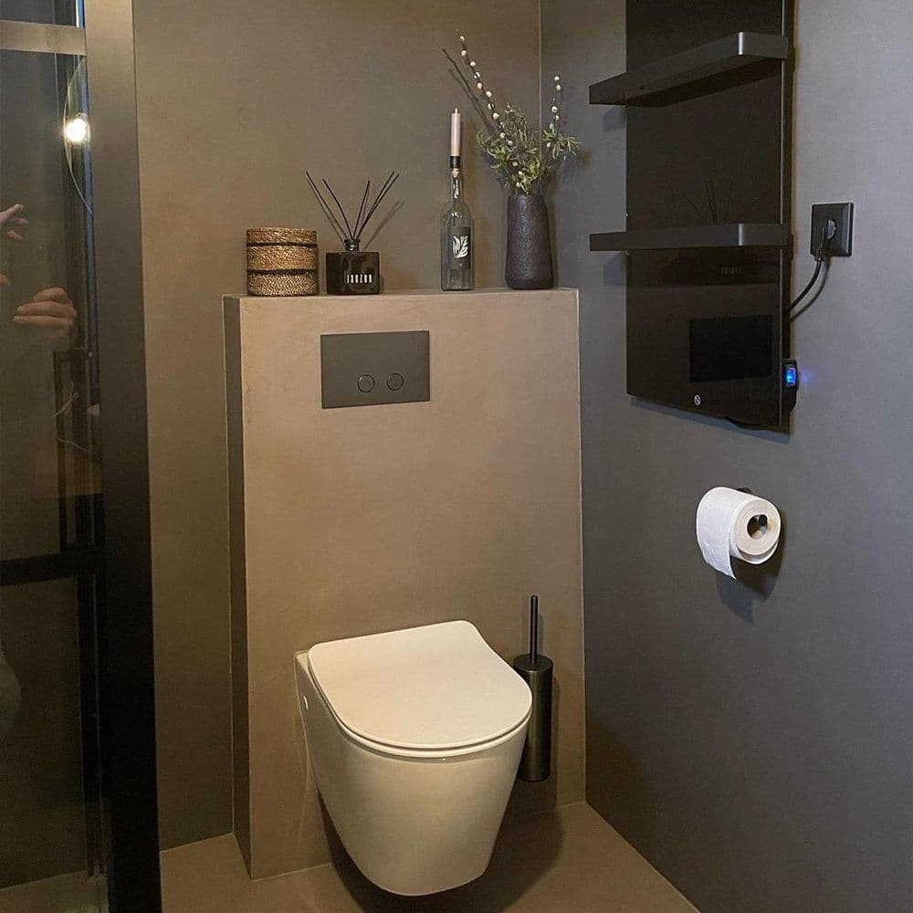 Gäste-WC mit fugenlosen Beton-Ciré-Wänden und -Boden in Grau